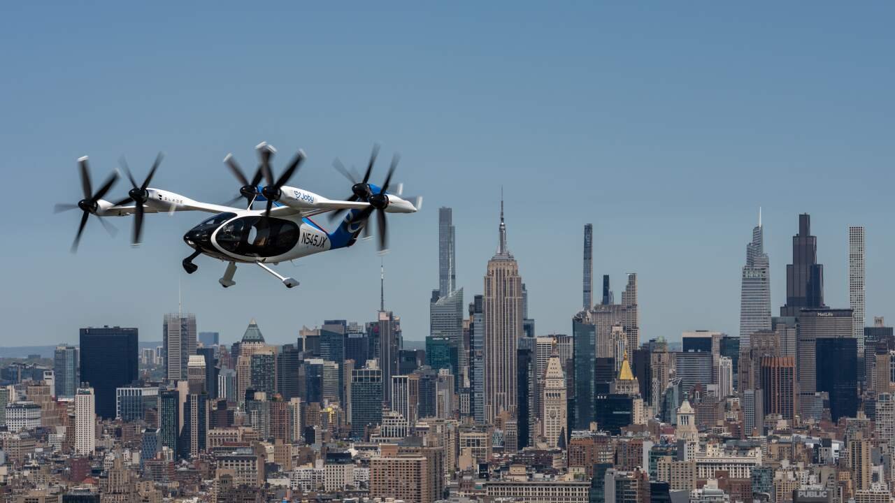 Integrating Vertiports and Electric Aircraft into Urban Transit Webs